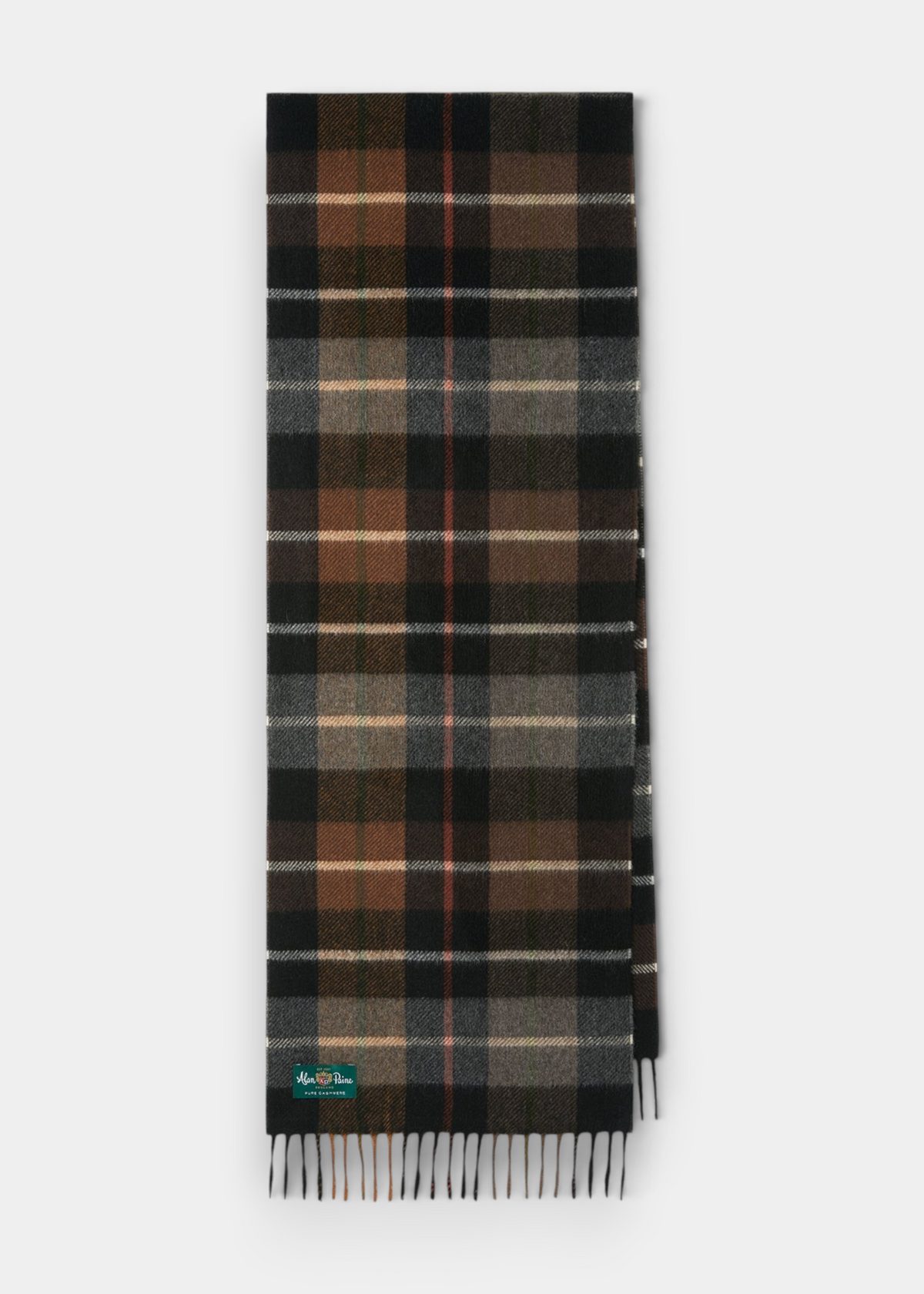 A folded plaid scarf in black, brown, gray, and beige tones, with a small green and white Barbour logo patch near the bottom left corner, set against a light gray background.