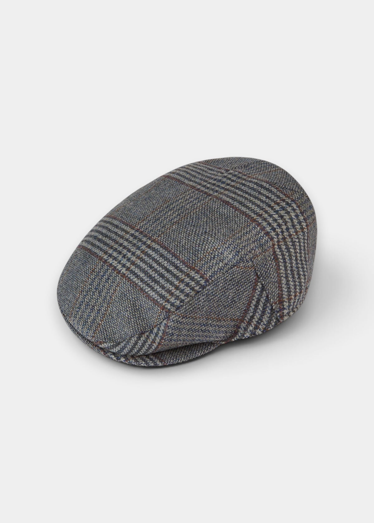 Surrey Men’s Tweed Flat Cap In Blue Check, a waterproof blue and grey tweed flat cap in a check pattern.