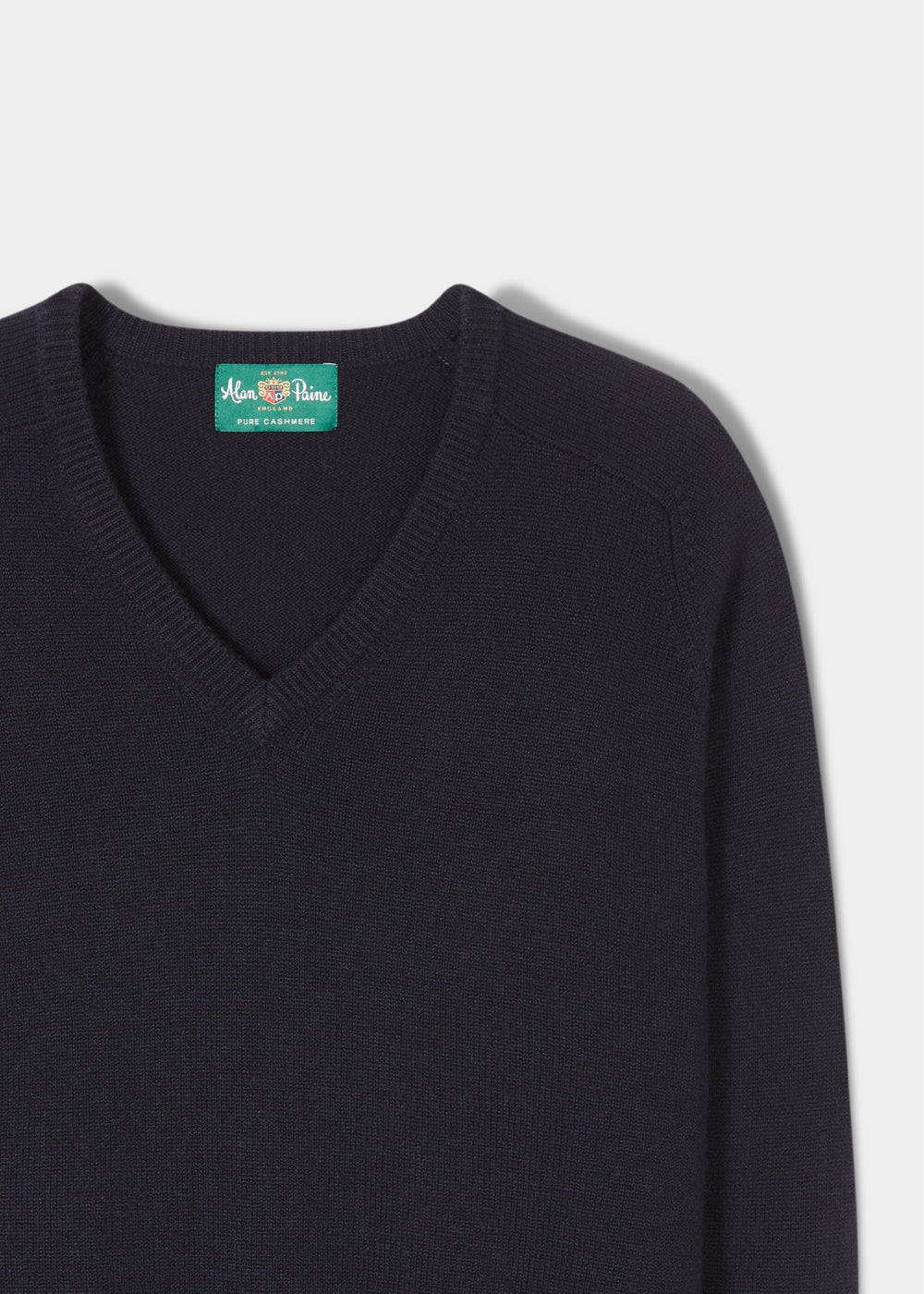 Selkirk Pure Cashmere V-Neck Jumper In Dark Navy with a green brand label at the inner neckline.