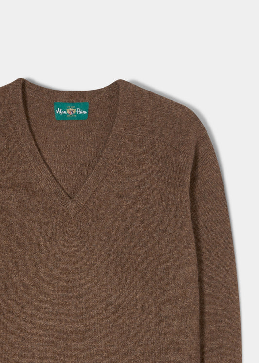 Kilsyth Lambswool V-Neck Jumper in Tobacco, regular fit, partly shown on white with a visible green neck label.