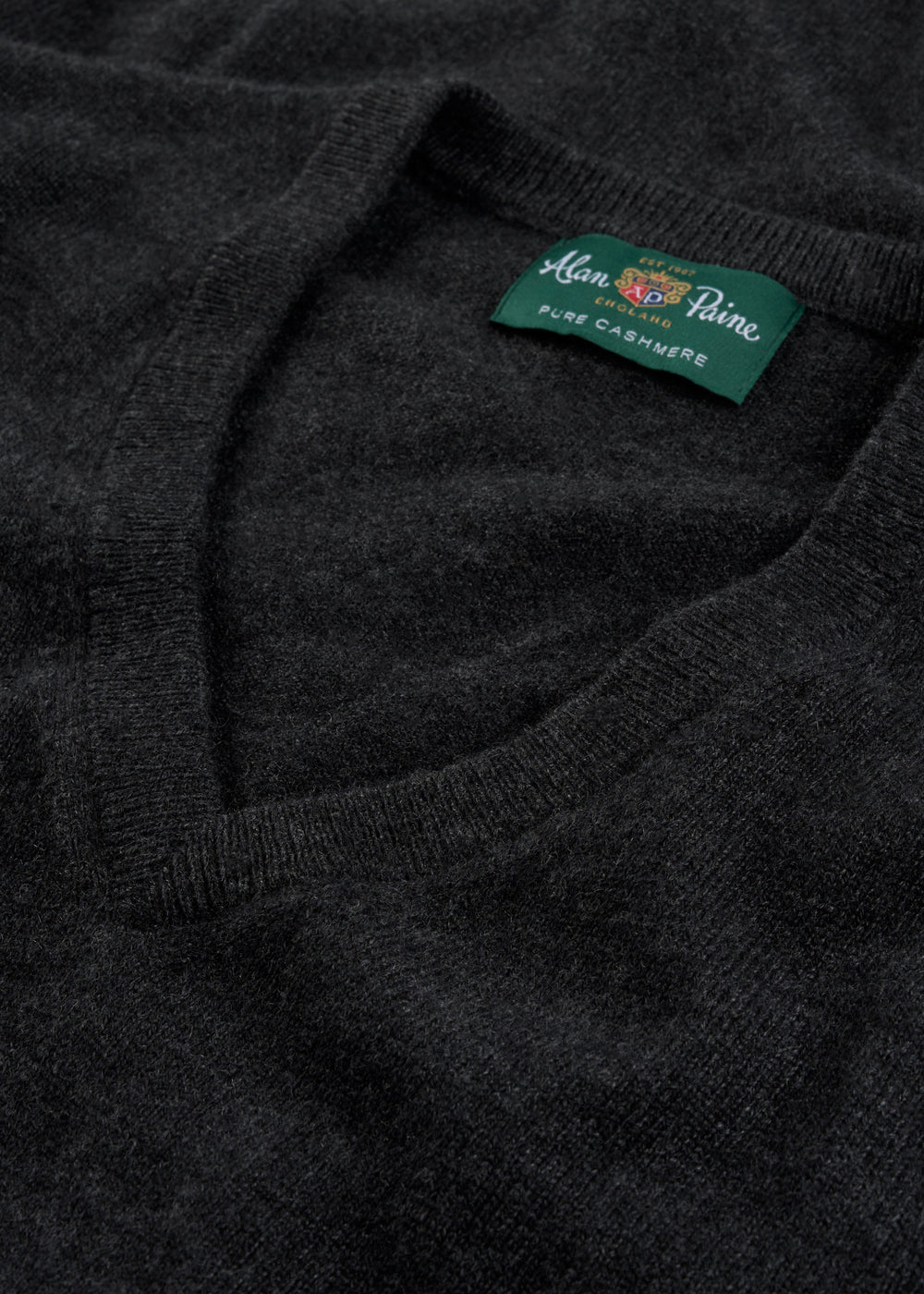 Haddington Pure Cashmere V-Neck Jumper in charcoal, regular fit, features a green Alan Paine label for luxury style.
