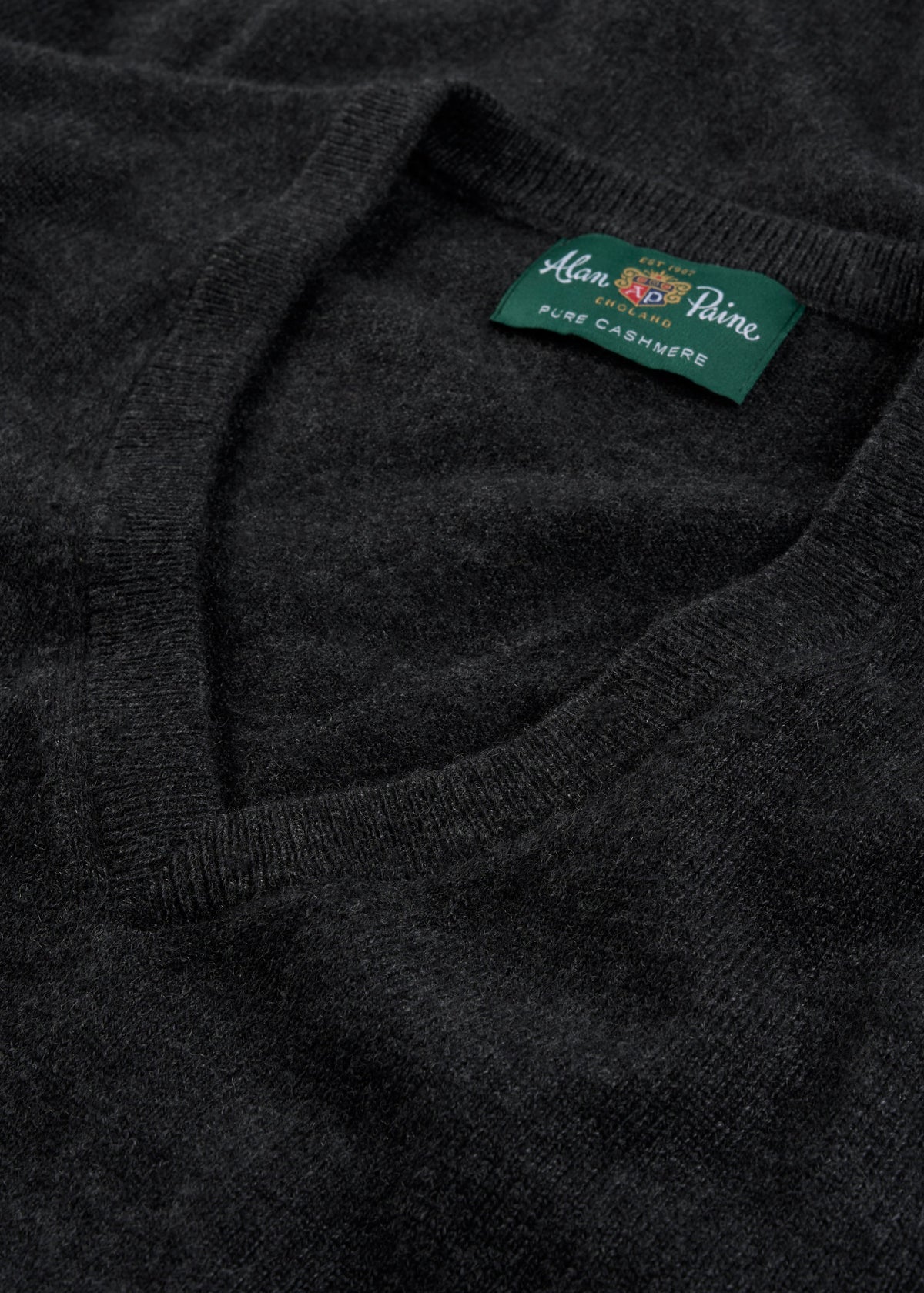 Haddington Pure Cashmere V-Neck Jumper in charcoal, regular fit, features a green Alan Paine label for luxury style.