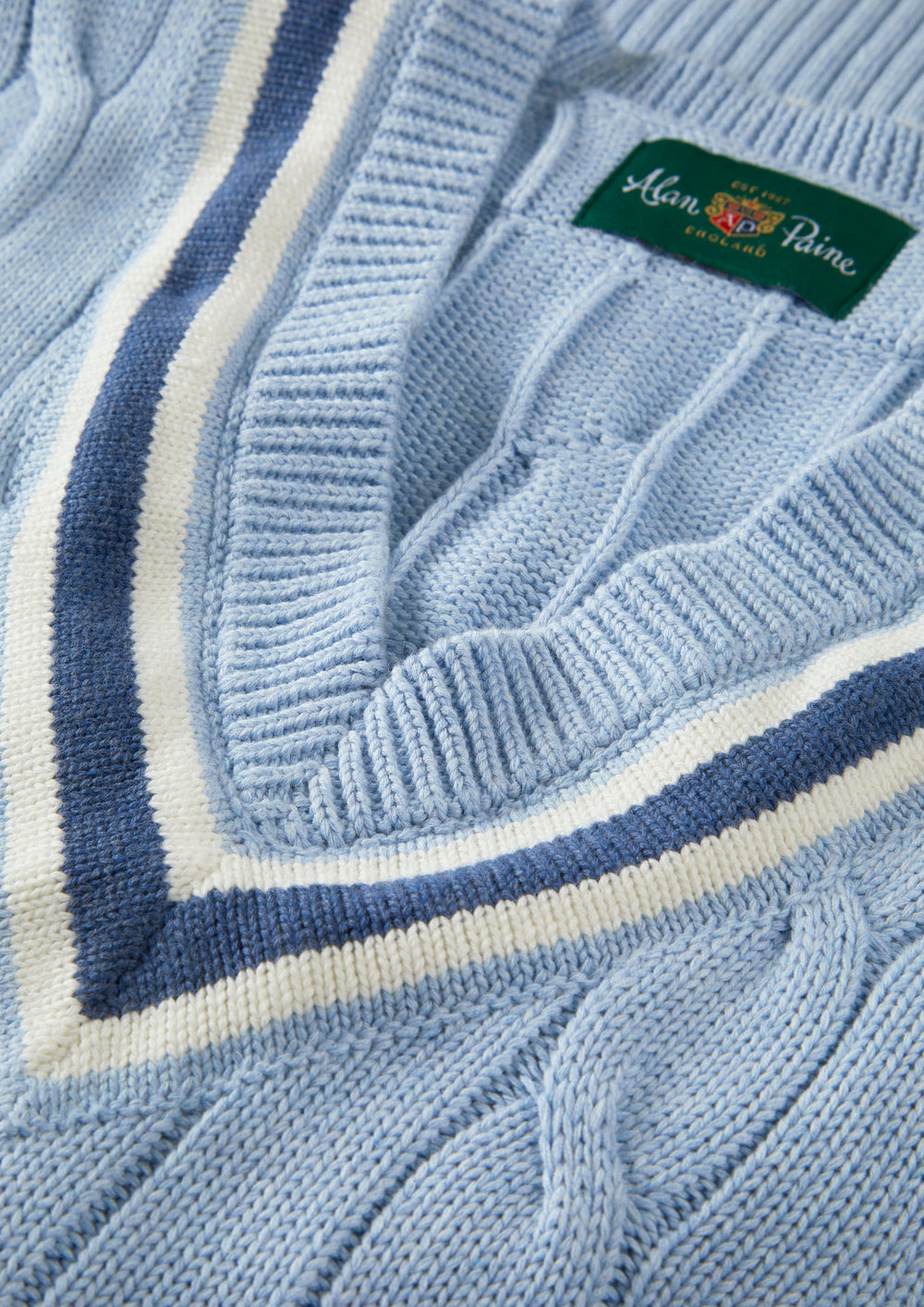 Steel blue Chadbury cotton cable knit V-neck cricket slipover, regular fit, with green Alan Paine England collar label.