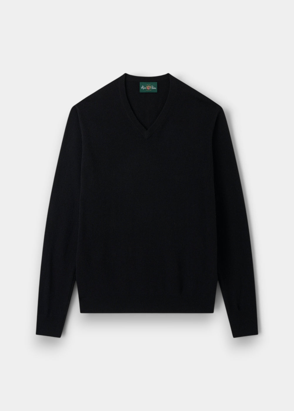 Albury Geelong Wool V-Neck Jumper in black, regular fit, laid flat on light grey; long sleeves, timeless style.
