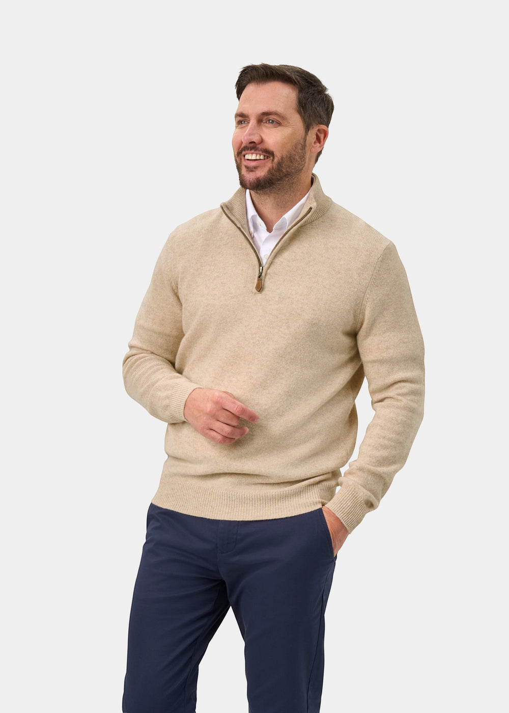 Alan Paine Sutherland lambswool 1/4 zip jumper in linen beige, featuring a mock neck and leather zip pull on a model.