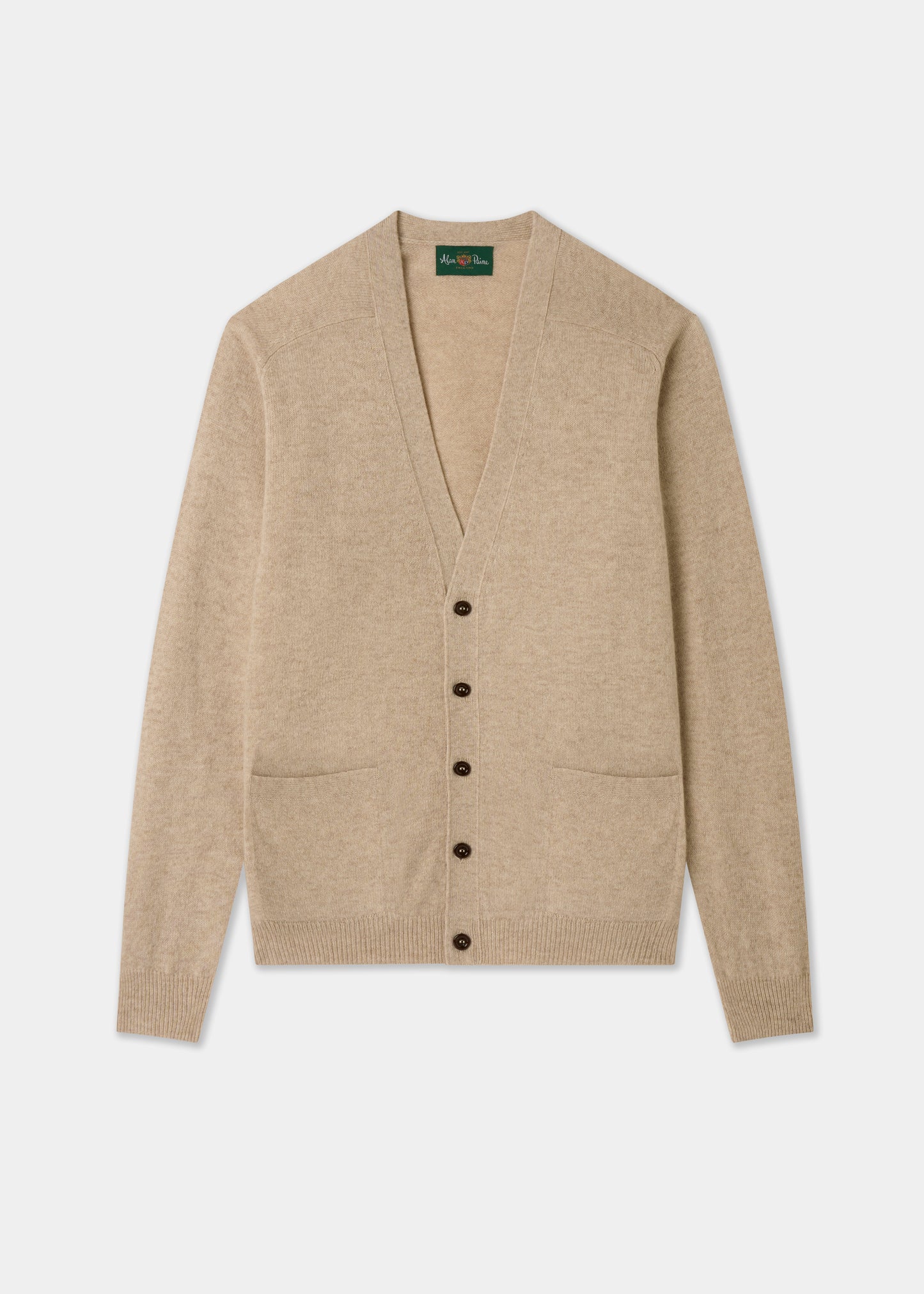 Beige cardigan with button details on a white background