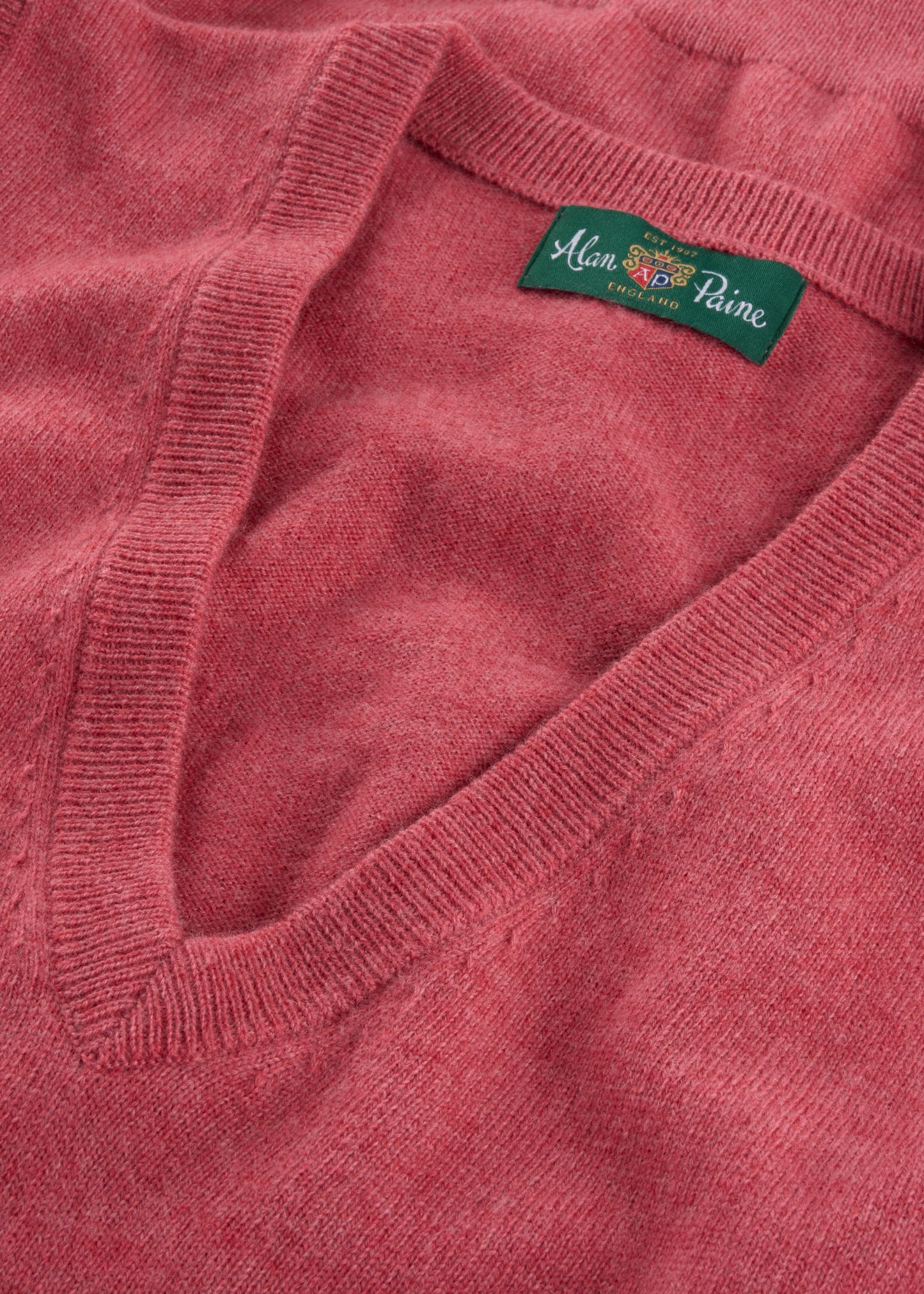 Pink vee neck jumper close up