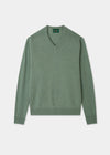 Green sweater on a light gray background