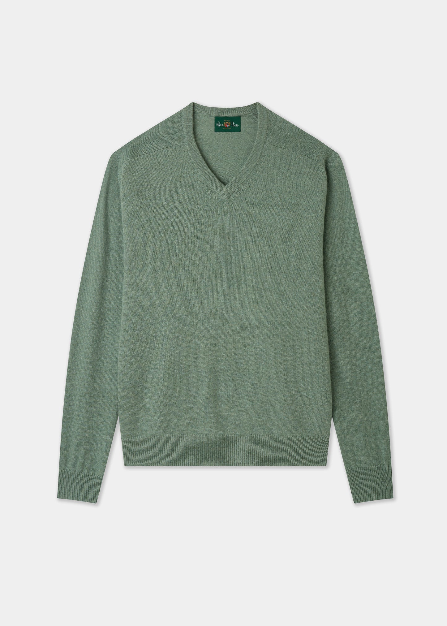 Green sweater on a light gray background