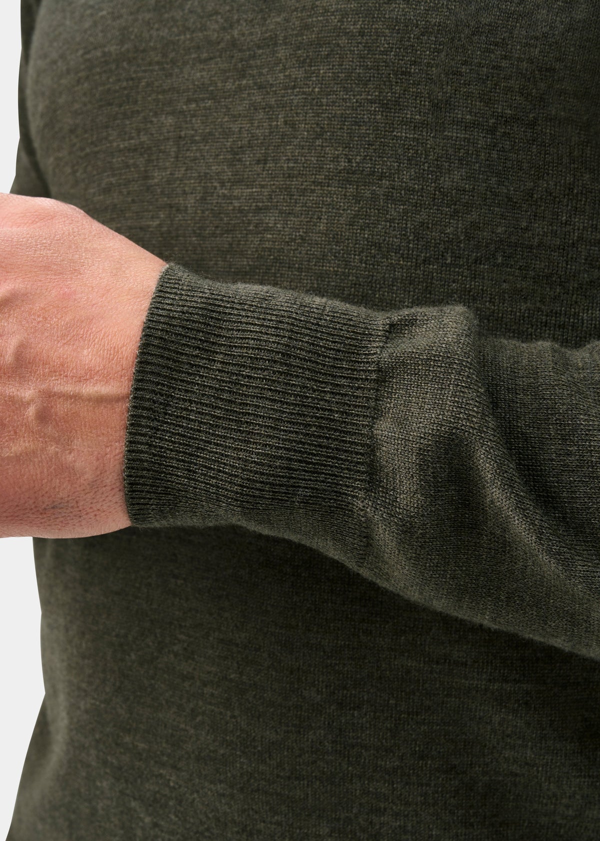 A close-up shows the detailed cuff of the Hindhead Men’s Merino Wool Polo Shirt in Seaweed, Regular Fit.