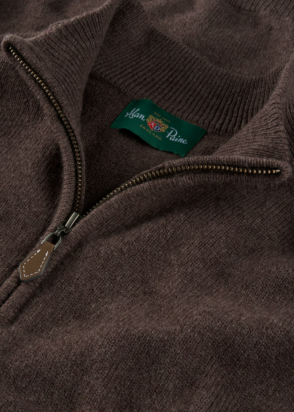 Close-up of a brown quarter zip jumper