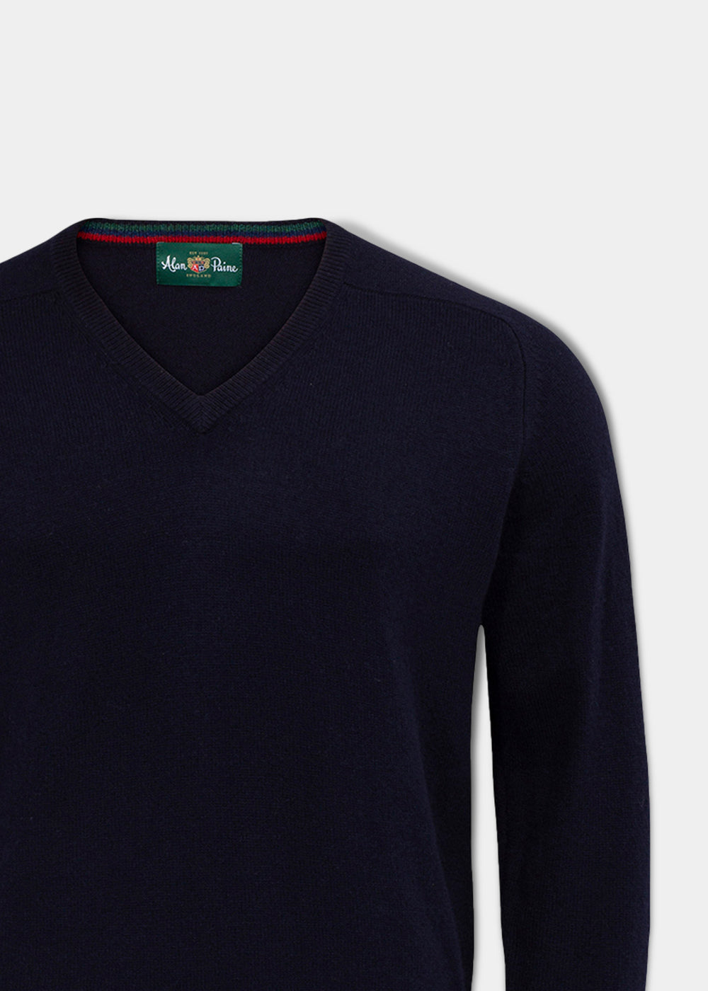 Streetly Lambswool V-Neck Jumper In Navy with a green interior neck label.